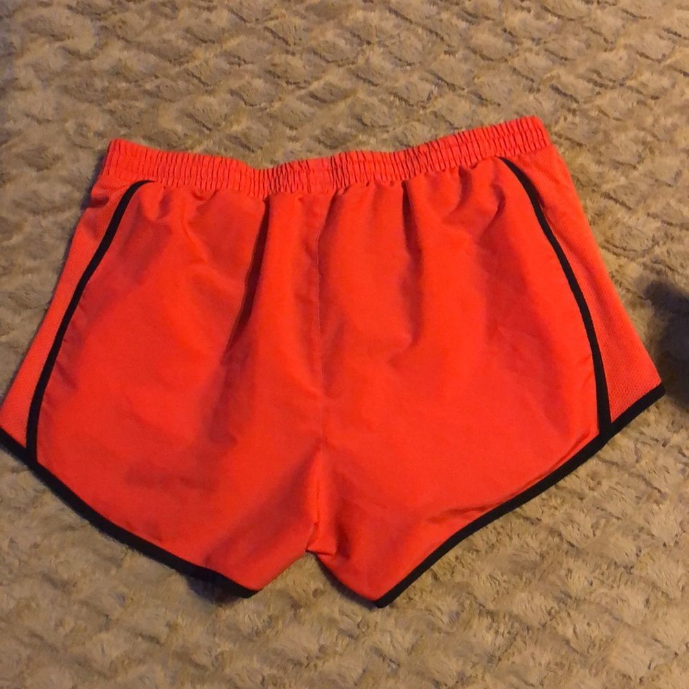 Under Armour athletic running shorts. Redish orange color. - Picture 4 of 4